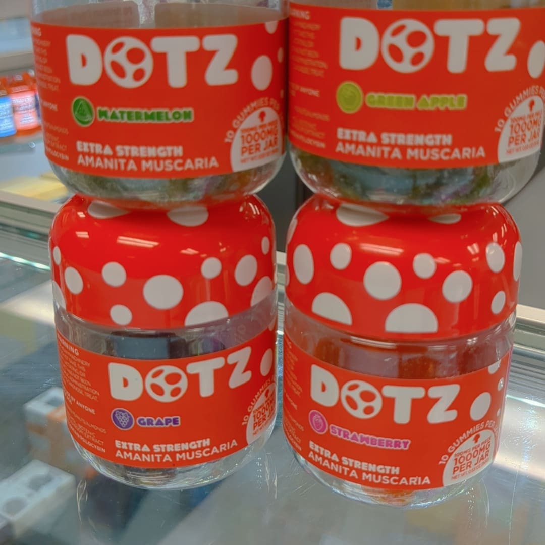 Three jars of dotz are stacked on top of each other